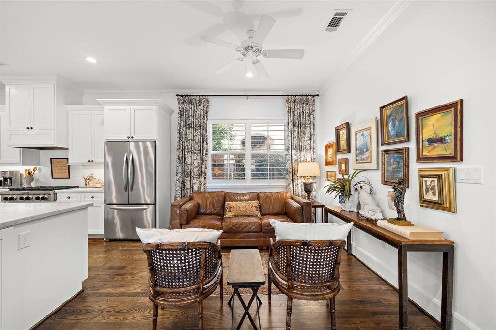Inviting breakfast bar adds additional seating making it the perfect spot for casual meals or gathering with guests.