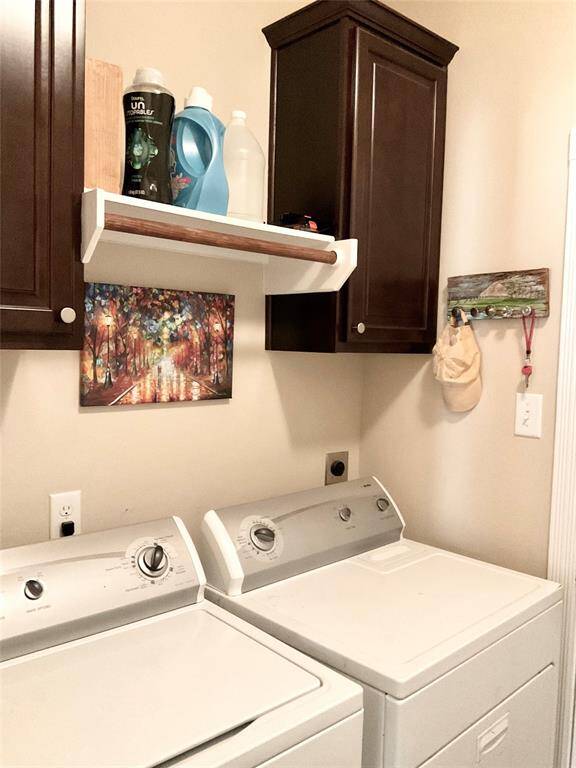 Your laundry room leading to the garage area and conveniently off the kitchen.   A washer, dryer and second refrigerator are provided for your use during your comfortable stay.