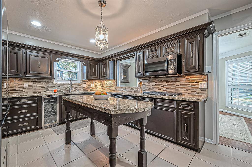 Enjoy sleek stainless appliances, complete with a wine refrigerator.