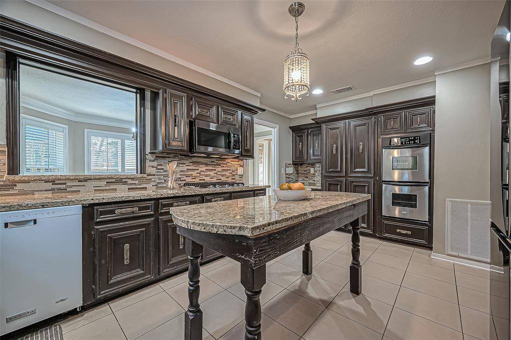 Charming passthrough window to the elegant dining room.