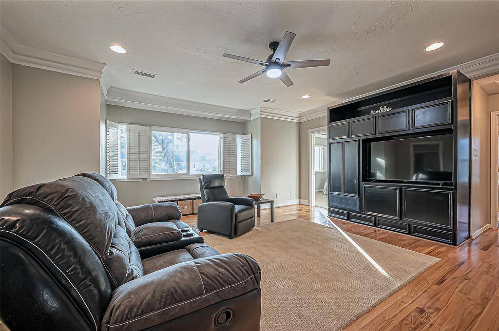 Upstairs features a spacious game room with a view over the living area.