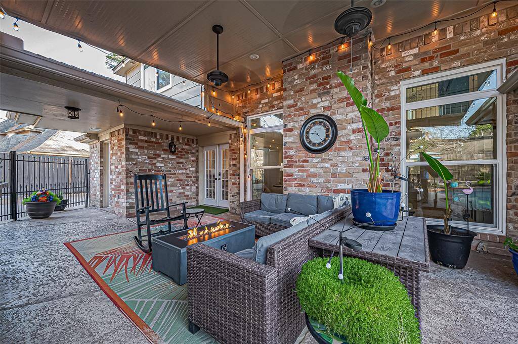Discover your private oasis with a covered patio, sparkling pool, and easy-care turf lawn.