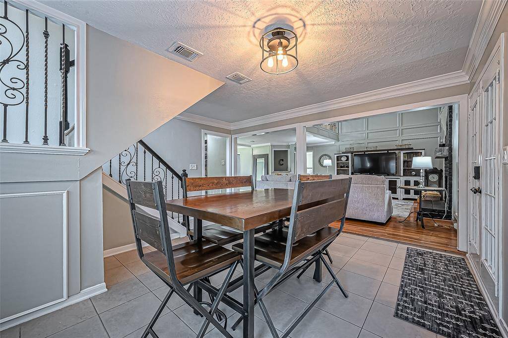 Charming breakfast nook by the patio doors, offering easy access to your private backyard retreat.