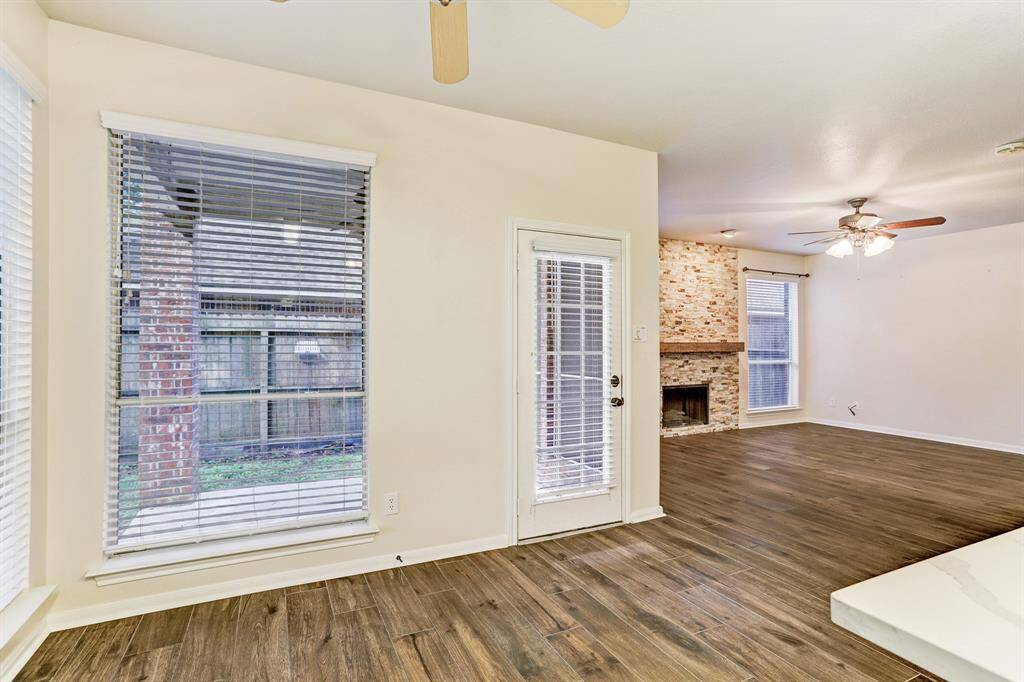 View of breakfast room and back door from the kitchen