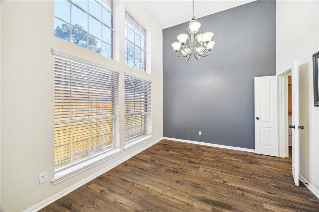 Large dining room with double doors to the kitchen
