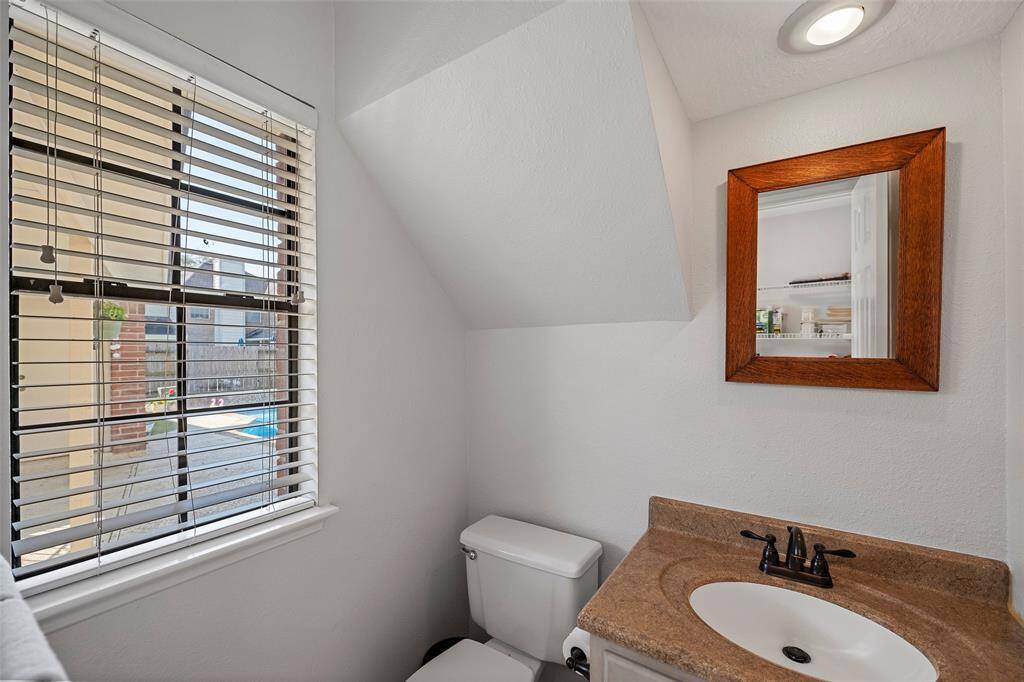 And this bathroom conveniently located just off the utility room, would be great designated as the "Pool Bath!"  No wet bodies running through the home to get to the bathroom!  We love it!
