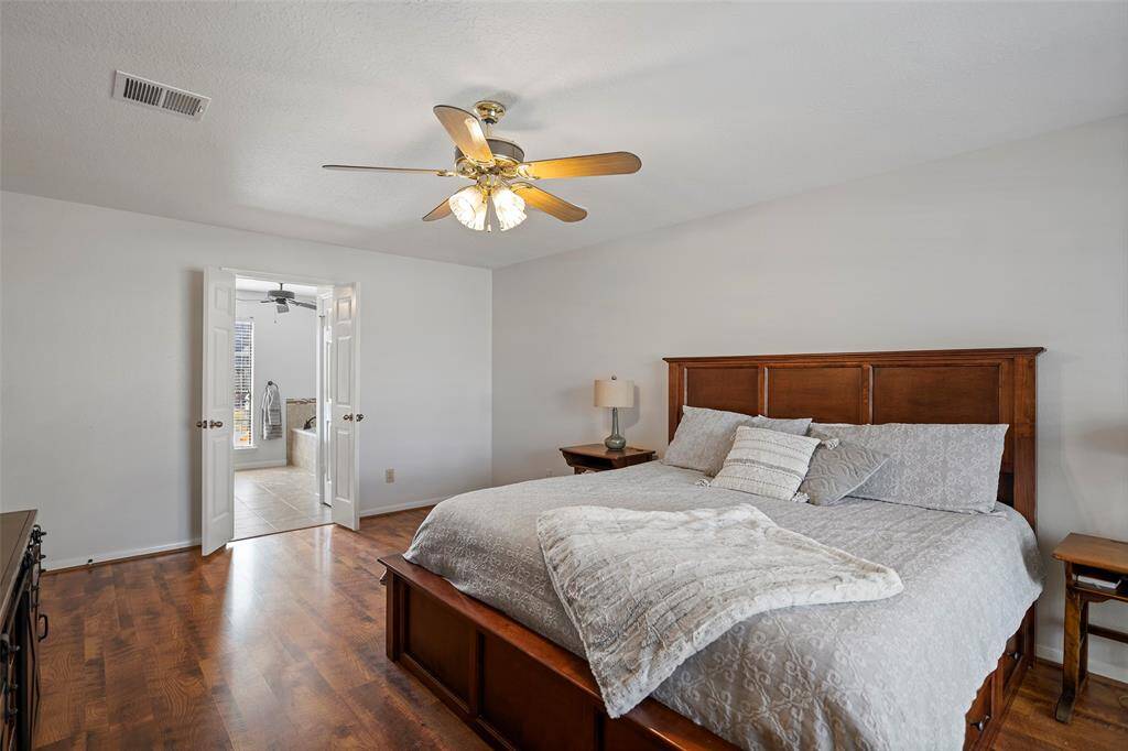 A serene and spacious primary suite awaits you for a peaceful night of slumber!  Neutral walls and gorgeous floors will compliment any decor you may have!