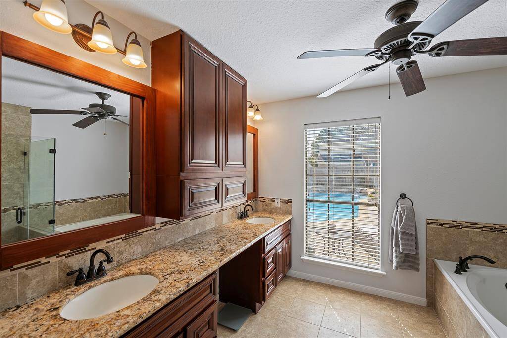 A dual sink vanity with knee space is prepared to help you start your day!  The window allows in natural light and views!