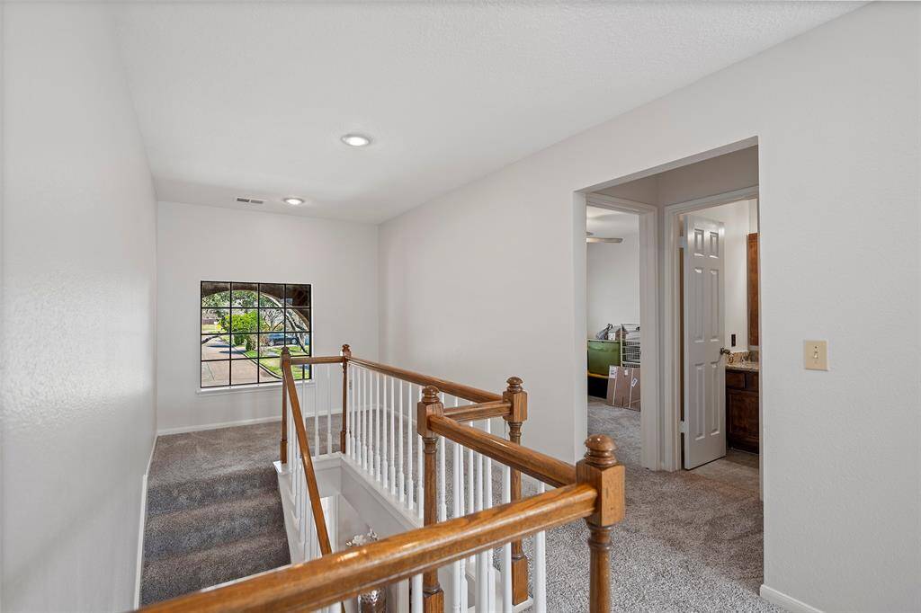 As you climb the stairs to enter the upstairs living spaces, you will come to this landing area that has views too!