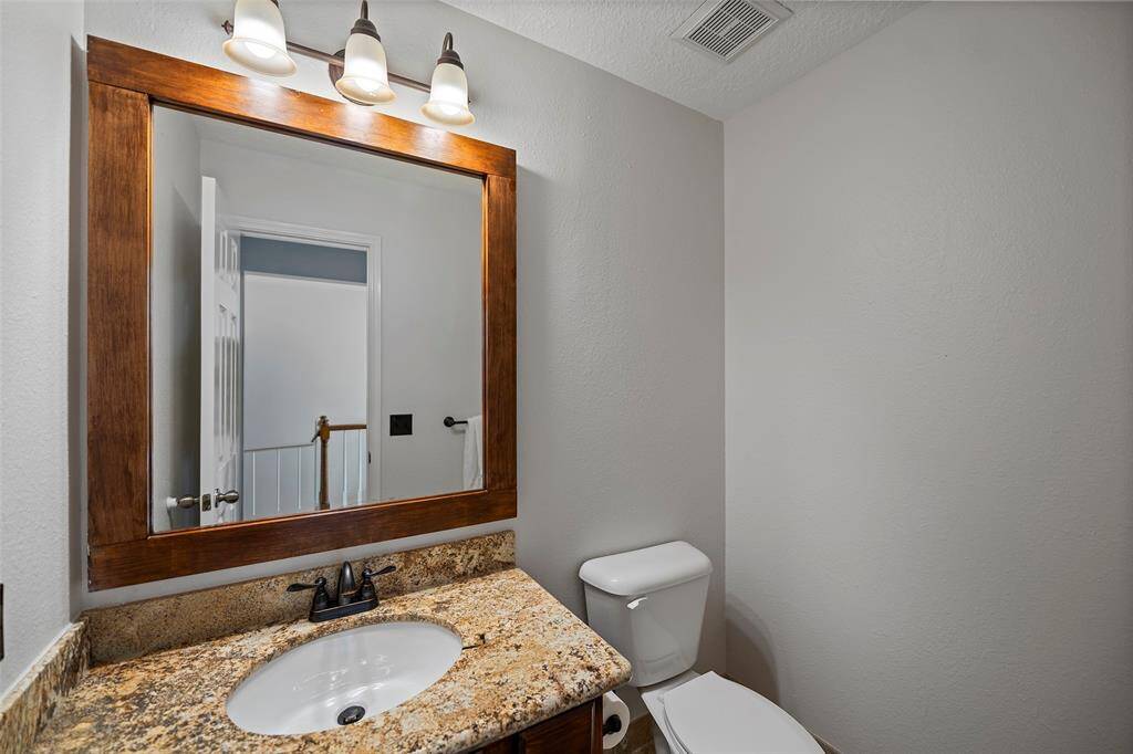 A powder bath just off the hallway gives guests a place to freshen up during a visit!