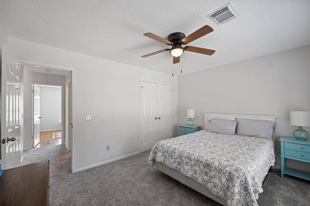 Another view shows how much room you have with a large bed, and the soft carpet under foot!