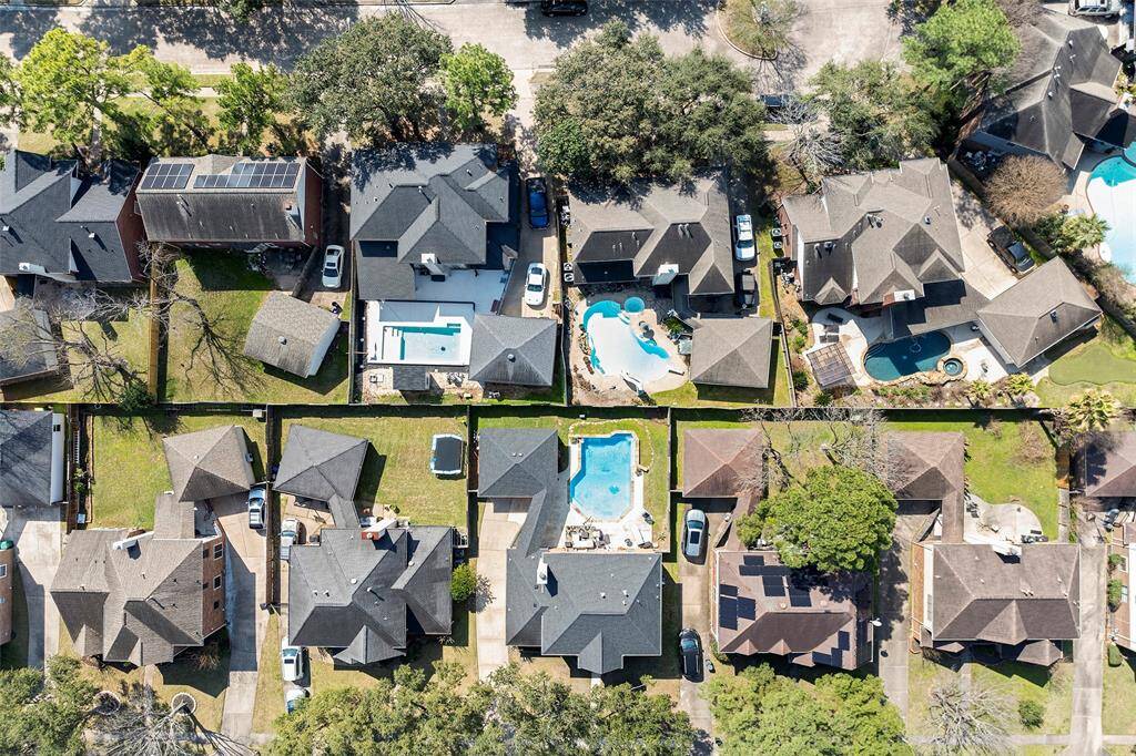 This bird's eye view shows the length of the expansive driveway and the size of your backyard oasis! Schedule your showing today!