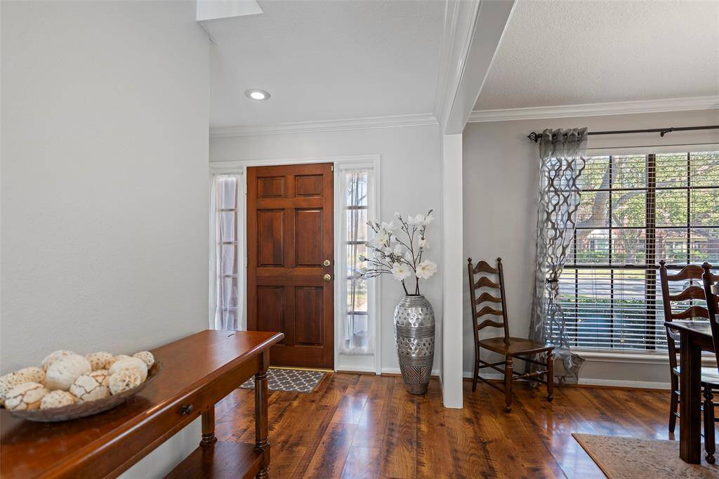Open the door to a wonderfully light and bright home with fresh interior paint that is so inviting! Gorgeous laminate flooring flows throughout the entry, into the formal dining room and family room creating a cohesive look that is so easy to maintain!