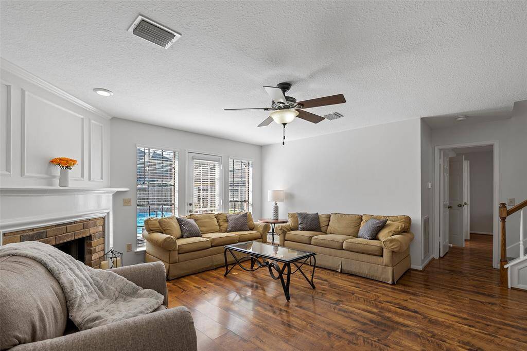 A wall of windows allows in the natural light and offers views of the sparkling pool!