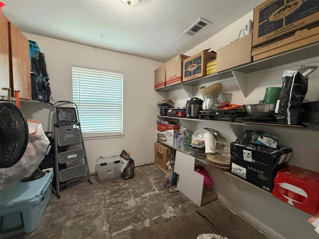 Huge storage area waiting to be built out as a butler's pantry