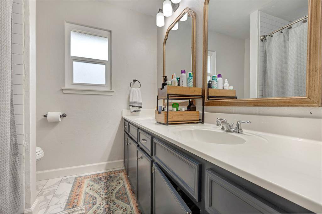 secondary bath with recent tile & plumbing fixtures
