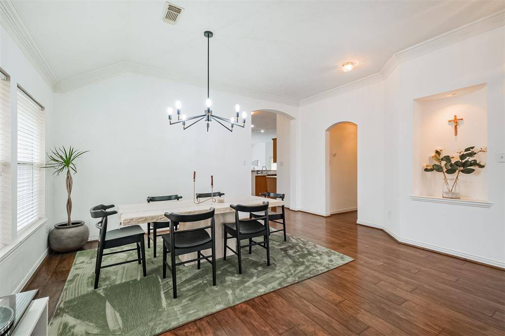 Formal Dinning room with updated chandelier and space for your large table!