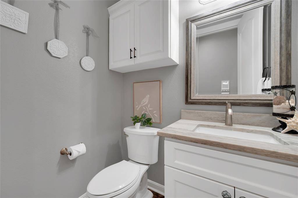 One of the two powder bathrooms off the living area has quartz as well.