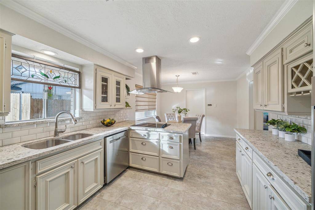 Timeless finishes flow through the kitchen