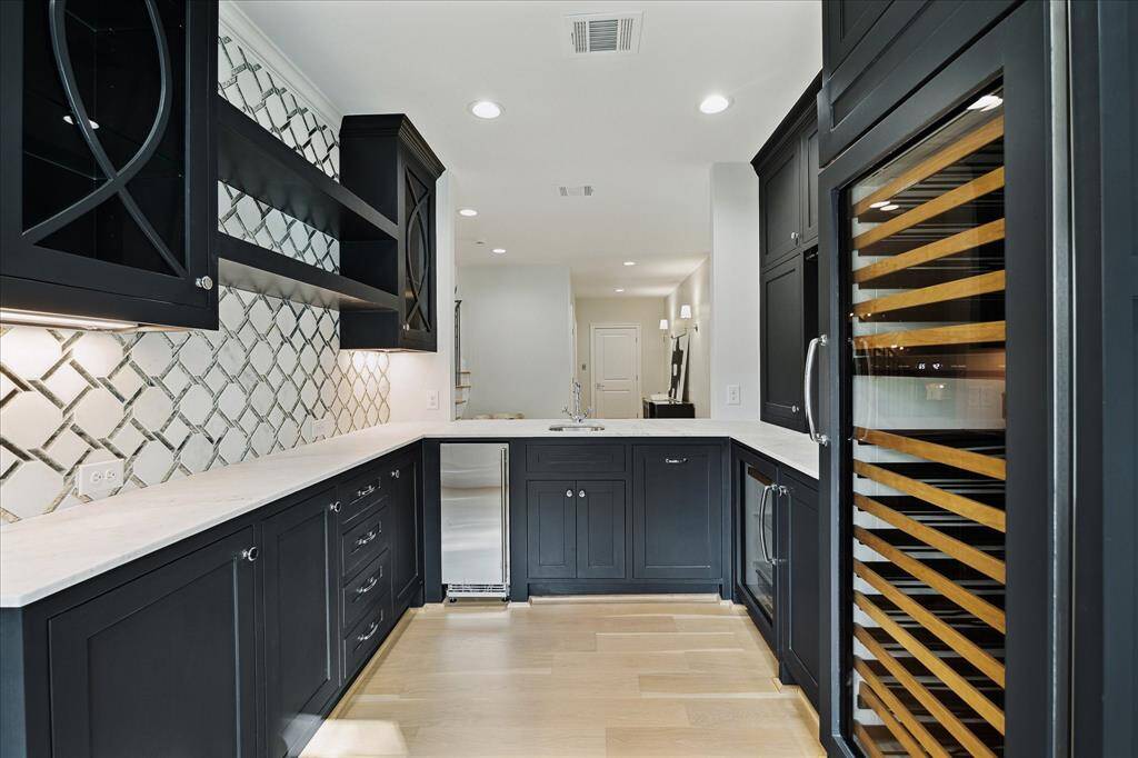 Close up of the Wine Room and Wet Bar.  Built in 146 Bottle SubZero wine column, Beverage Refig, and Ice Maker.