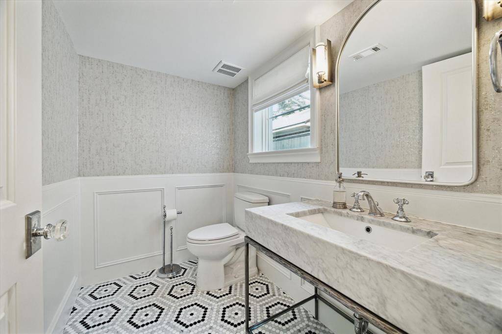 First floor Powder Room, located off private hallway.