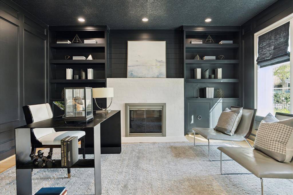 Handsome Library with bookcases, gaslog fireplace. Privacy double glass doors.,