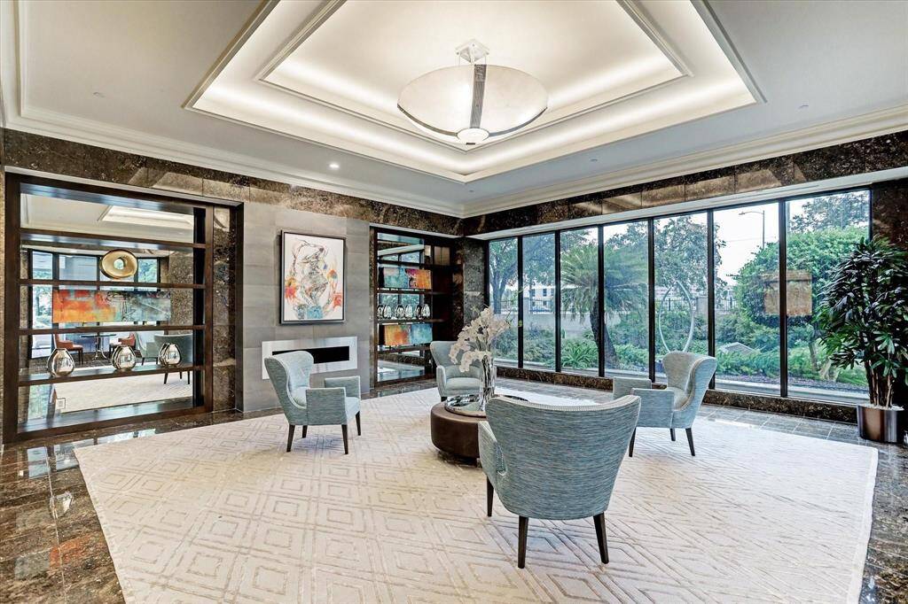 Convenient city living w/ in-unit washer & dryer & amazing building amenities, inc. 24-hour guarded gate, valet, concierge, climate-controlled pool, dry sauna, steam room, gym, racquetball & tennis court, running track, pet run, outdoor kitchen & dry-cleaning drop-off.