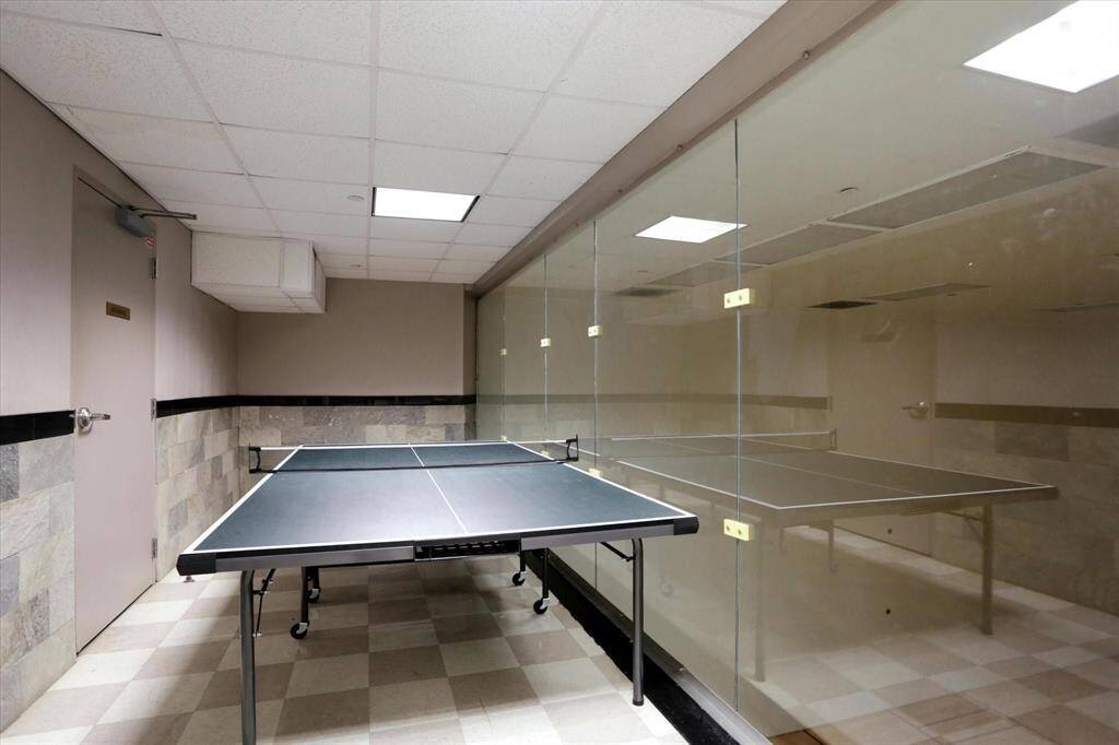 Engage in a table tennis game with a group of friends to unwind!
