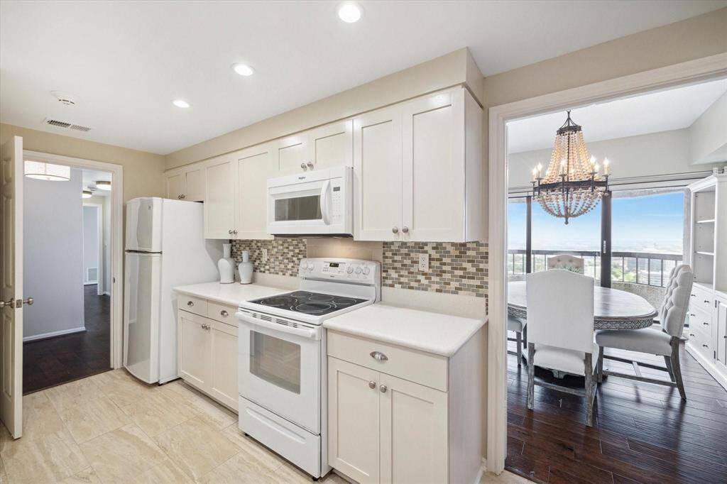 Well lit galley style Kitchen opens to the Foyer and Dining Room and can be closed off from guests to hide those pot and pans, while you entertain!