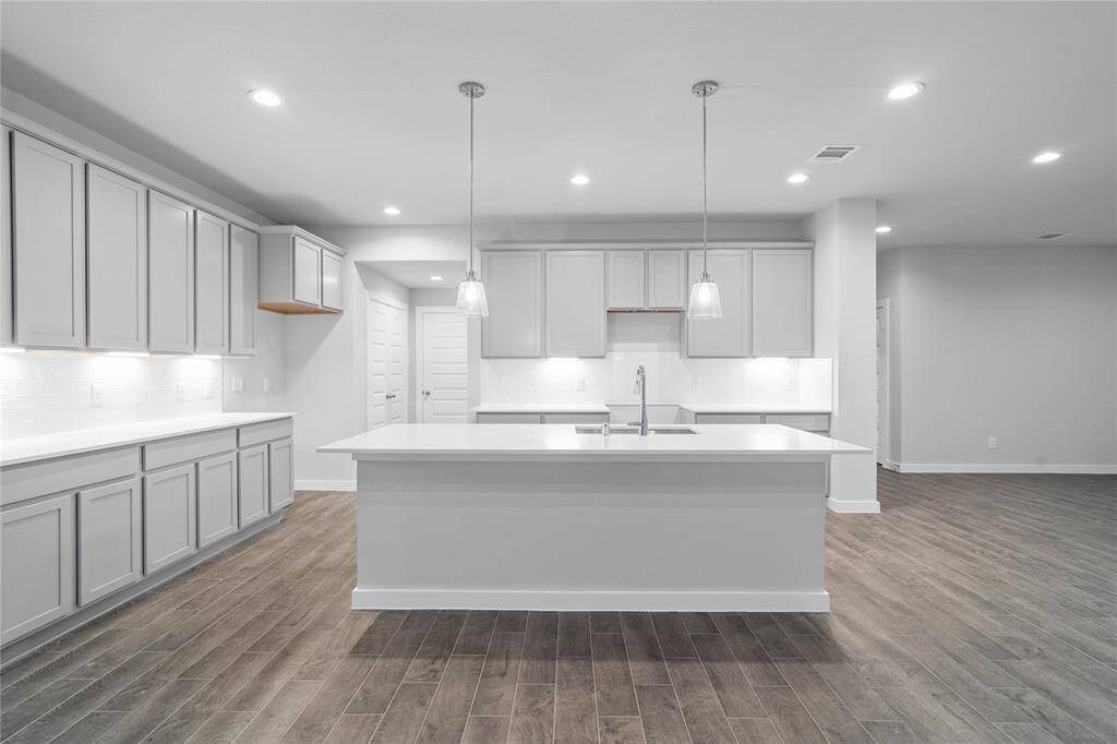 Additional view of this spacious kitchen and the ample amount of counter space!