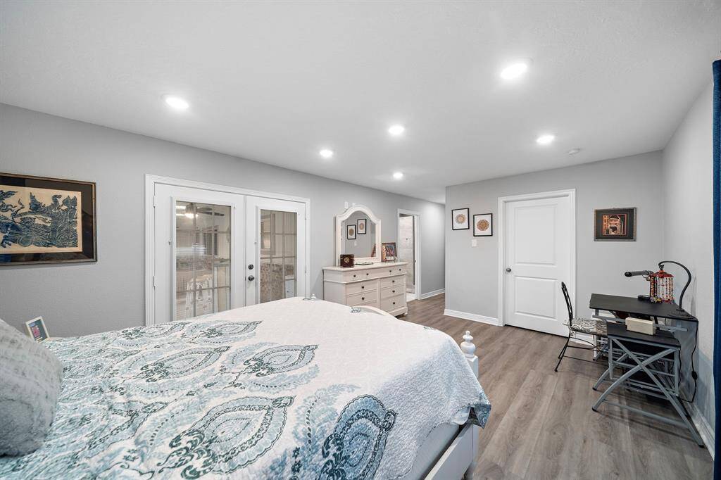 French doors lead directly to the backyard, creating seamless indoor-outdoor living.