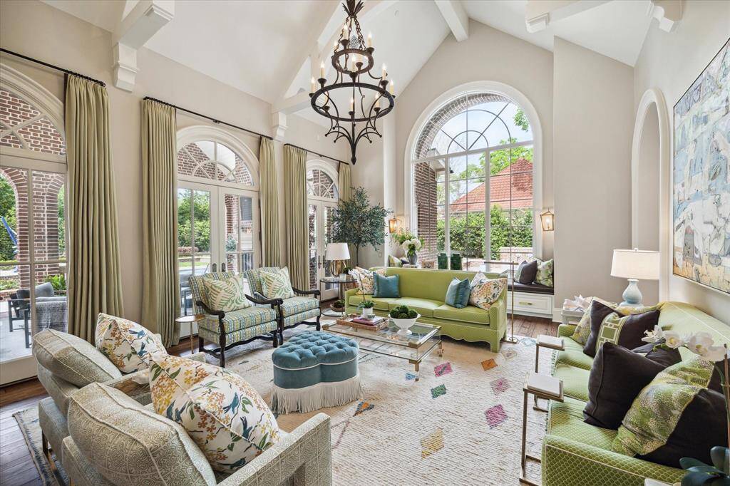 The “ooh and aah” sunroom! Once you come in through the curtained archway, you will not want to leave. Beneath the beamed trusses, the Palladian style window and doors bring the outdoors in. Curl up with a good book and turn the fireplace on in the winter or open the doors during a pool party in warmer weather. Families will be drawn to this room.