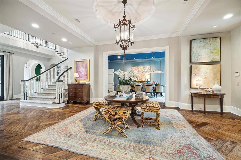As you enter the beautiful home, the interiors designed by Nicole Zarr, of Triangle Interiors, will take your breath away. Notice the gleaming white oak plank floors laid in herringbone fashion. Home has a warm traditional layout including formals that flank the wide entry hall.