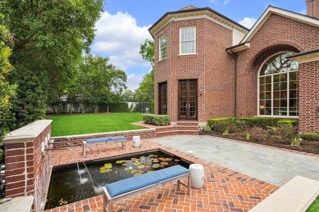 Say hello to the koi fish in the pond. Sorry, no fishing allowed! Also, notice the ample green space… perfect for a batting cage or possibly a pickle ball court!