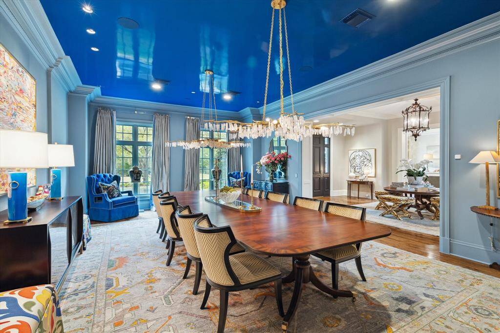 Imagine the dinner parties and family festivities that occur here in the amazing dining room with its lacquered ceiling, dual chandeliers and silk draperies. Homeowner designed the dining room to hold even the most lavish events. There’s room for everyone!
