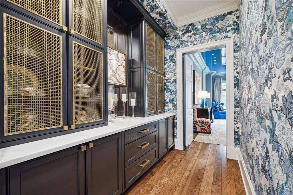 A sneak peek into the butler’s pantry. Every nook and cranny is meticulously styled with handsome hardware and other designer touches.