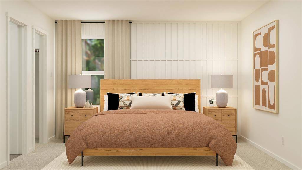 The first-floor owner’s suite offers a serene bedroom, luxurious en-suite bathroom, and spacious walk-in closet.