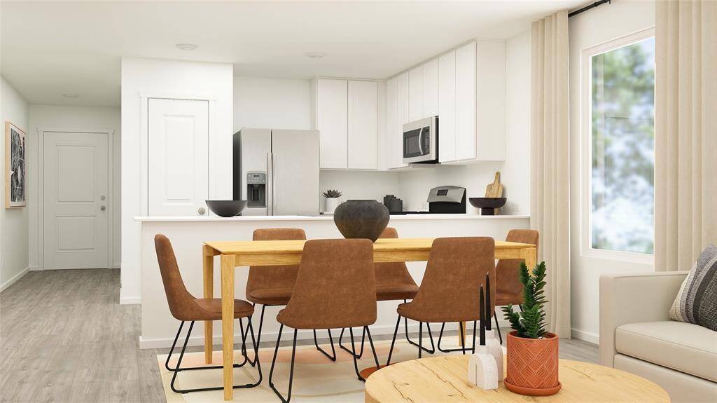 The dining room, conveniently located next to the kitchen, offers seamless meal transitions.