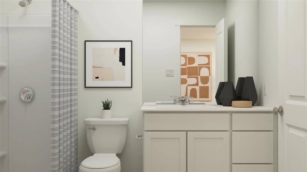 Experience convenience with an ensuite featuring a sleek sink and versatile shower-tub combo.