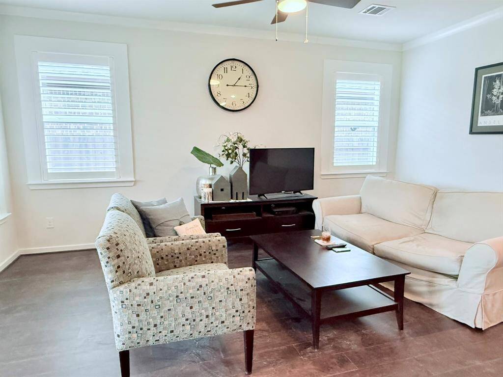 Bright & Airy Living Room – The open-concept living space is bathed in natural light, featuring high ceilings and stylish finishes perfect for relaxation or entertaining.