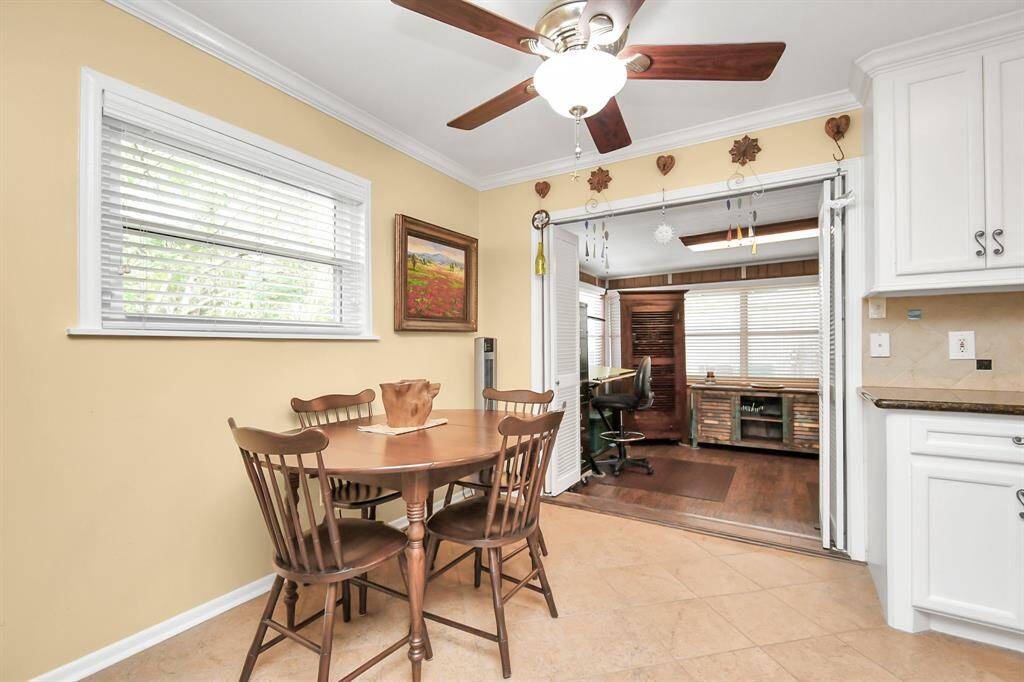 view from dining/kithcen into sun room/office/flex space