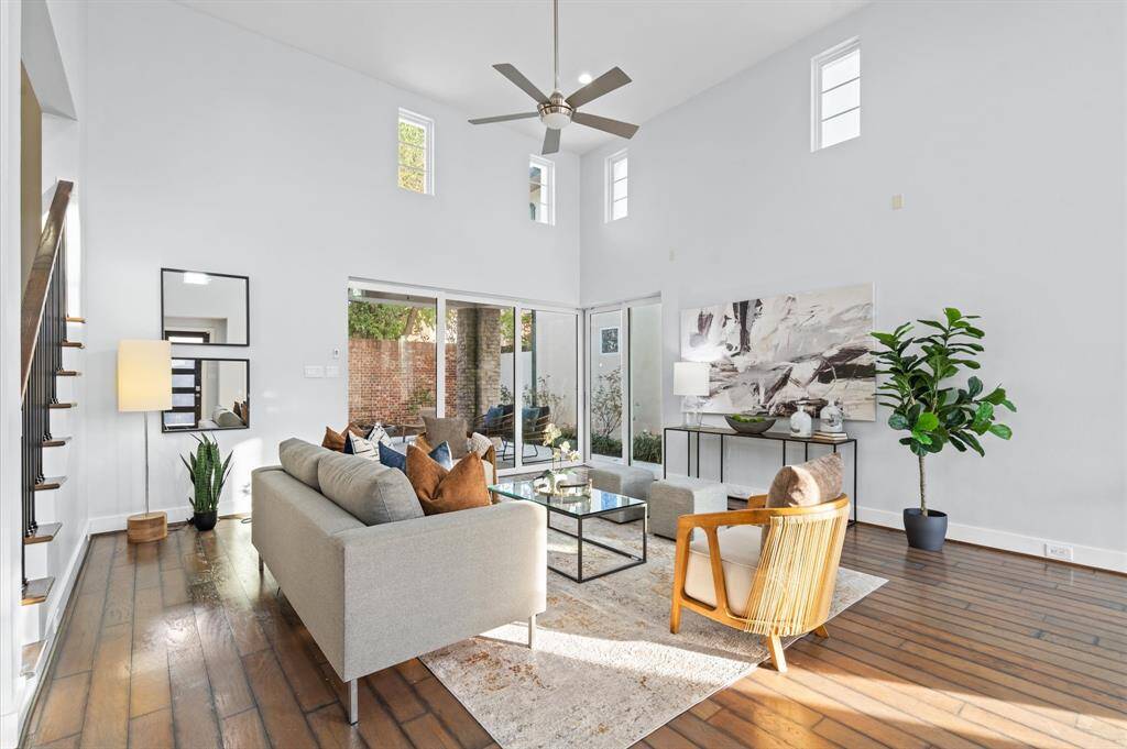 High ceilings and clean lines, this space is bathed in natural light and showcases stunning sliding pocket doors that seamlessly connect indoor and outdoor living areas.