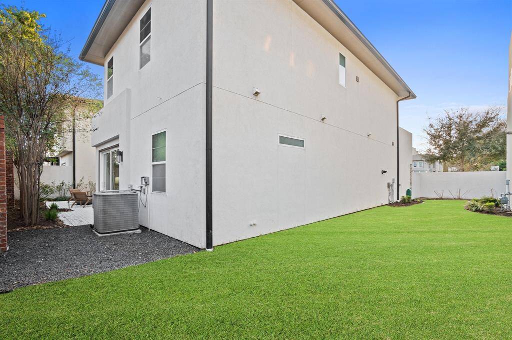 This is the only home in the entire subdivision featuring a lush grass side patio, complementing the inviting courtyard and providing a unique outdoor space.