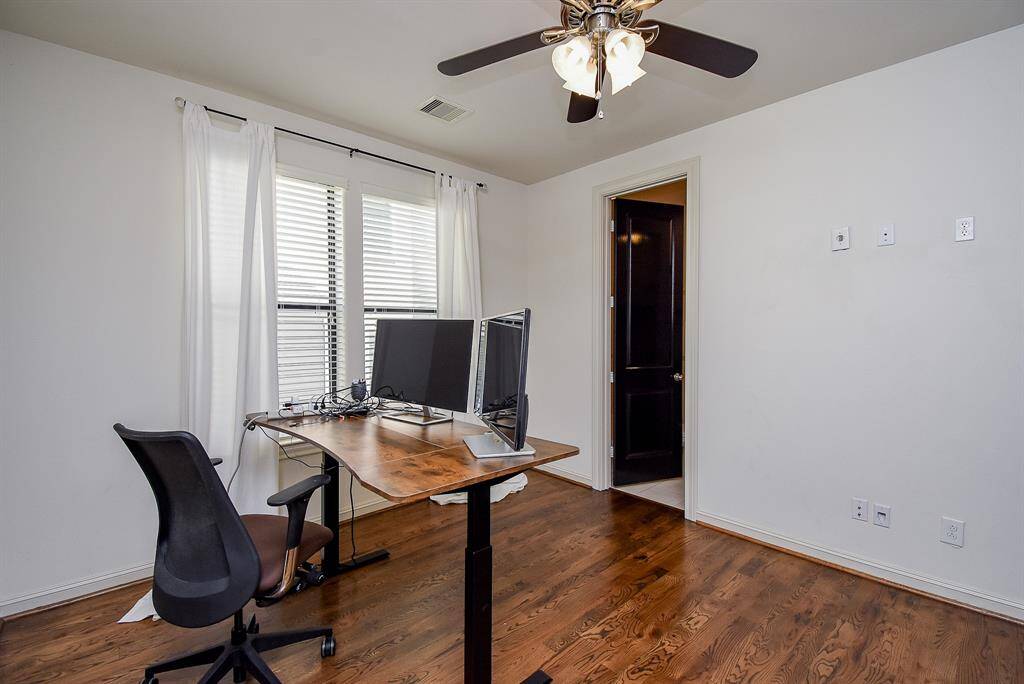 This bright and airy secondary room features large windows to allow natural light to flood the space!Whether you're working from home or just need a quite space to focus, this room provides the perfect balance of functionality and relaxation.
