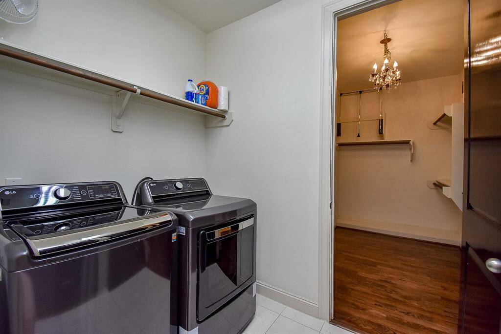 Spacious laundry room is conveniently located on the second floor between primary suite & secondary bedroom.