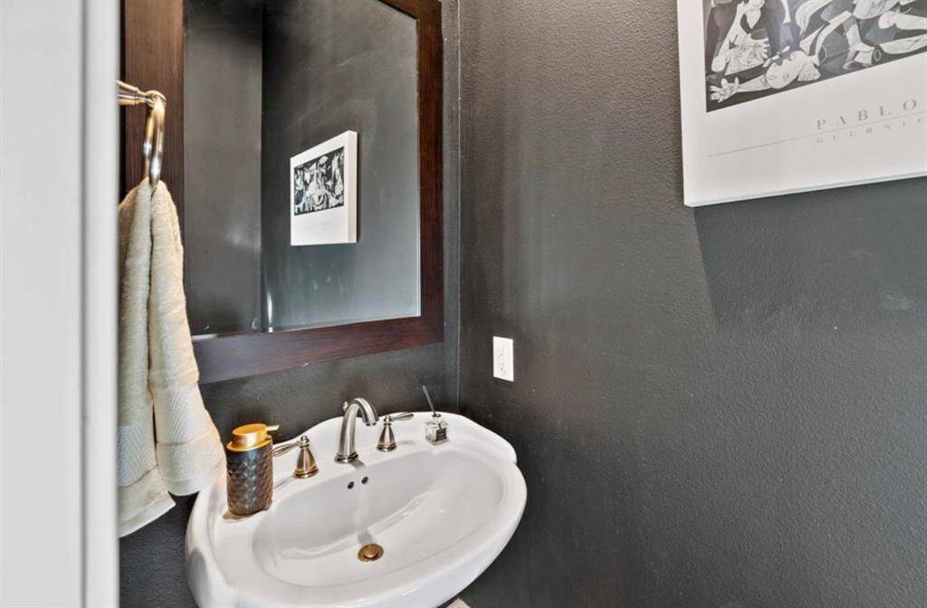 powder toom off the entry makes it perfect for guests, and the simple yet elegant design adds to the overall charm of the home.