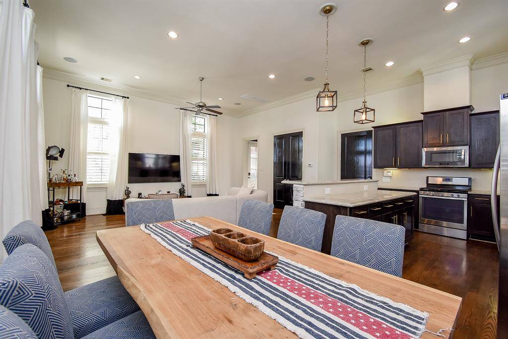Another view of the first floor living, kitchen & dining! The kitchen is not only gorgeous but functional with open views to the dining & living areas.