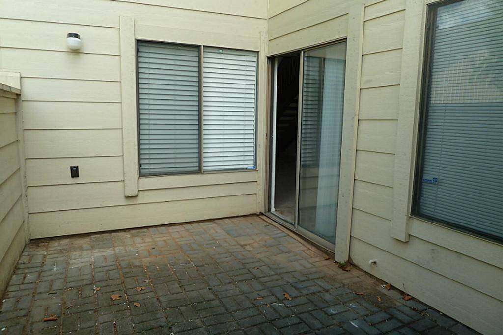 Private back patio is great for relaxing and for your bar-b-que with access to the two car garage.