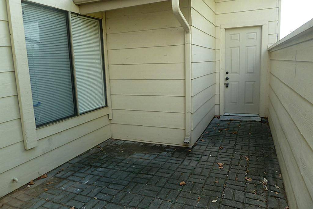 Spacious back patio leads to two car garage