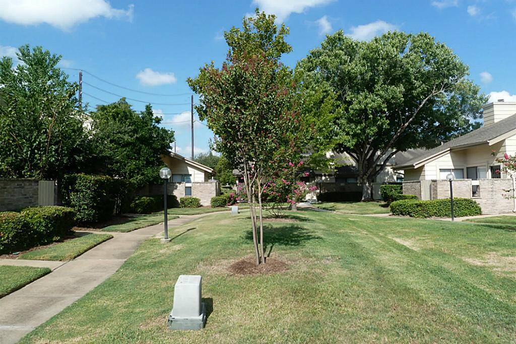 Lovely front green space is maintained by the HOA